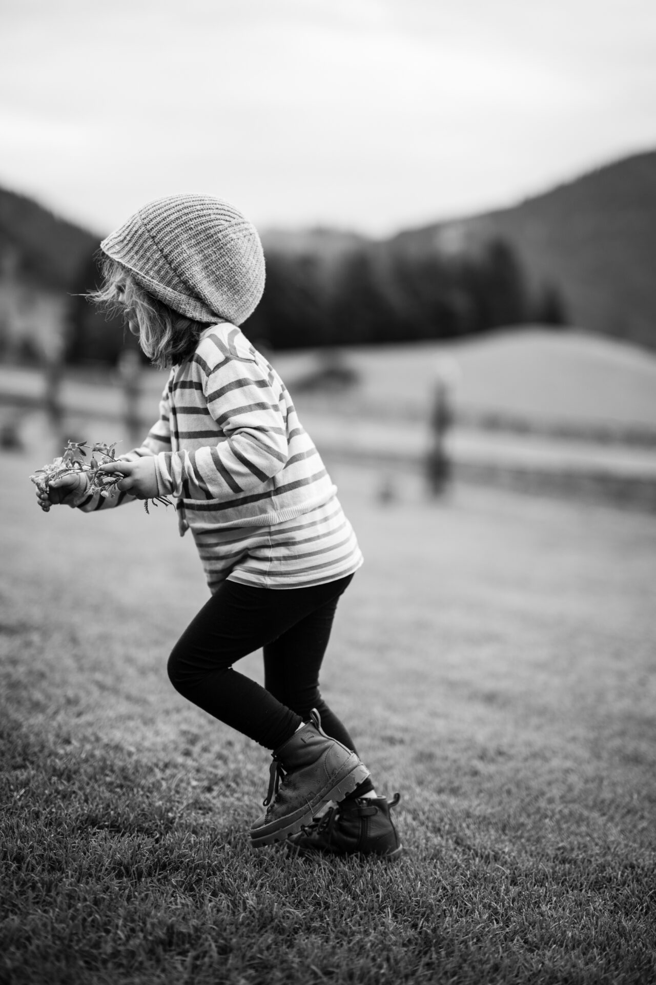 a woman smiling while putting on makeup
